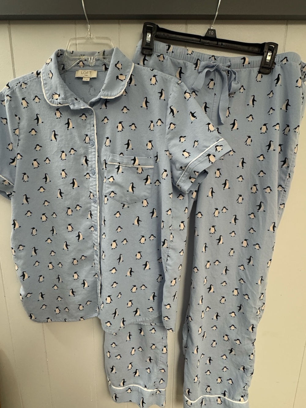 LOFT pajama set with a whimsical penguin pattern and classic button-down design